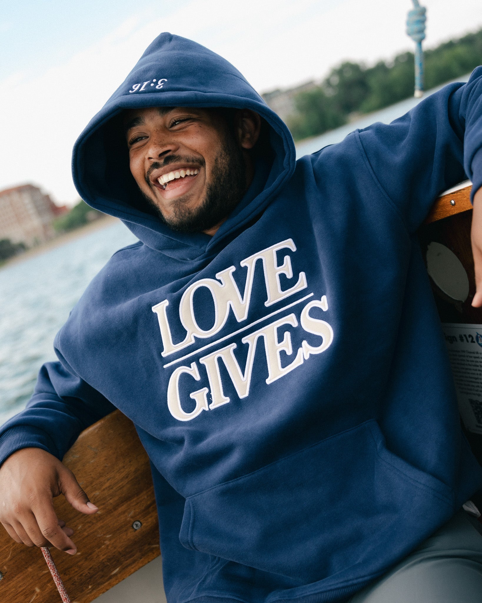 "LOVE GIVES" Navy Comfort Hoodie - Proclamation Coalition