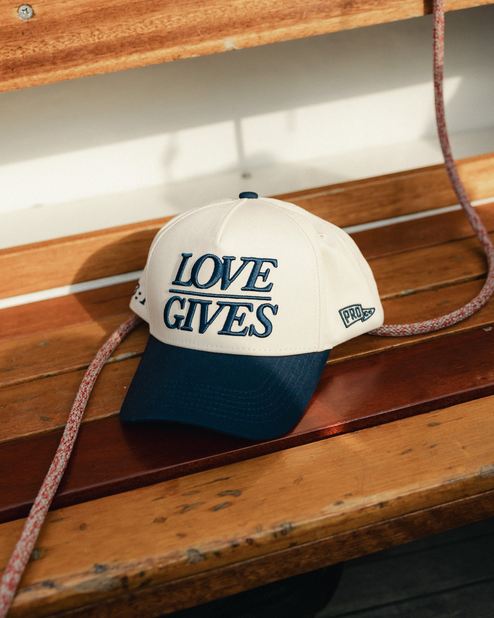 "LOVE GIVES" Navy Hat - Proclamation Coalition