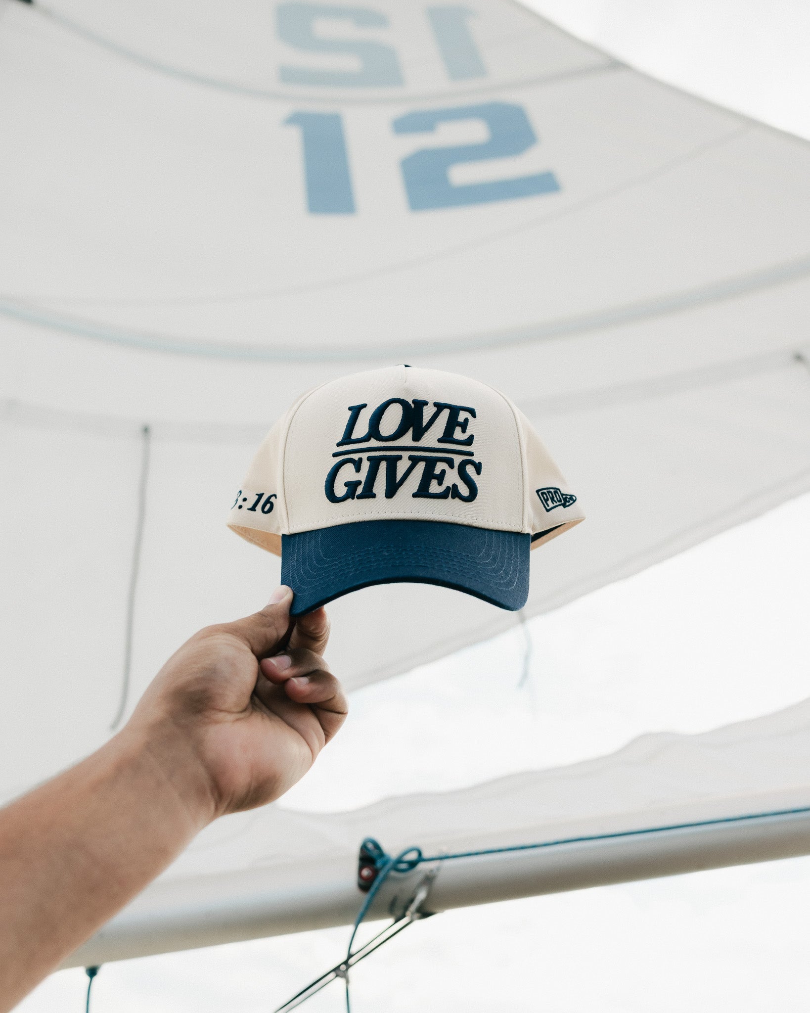 "LOVE GIVES" Navy Hat - Proclamation Coalition