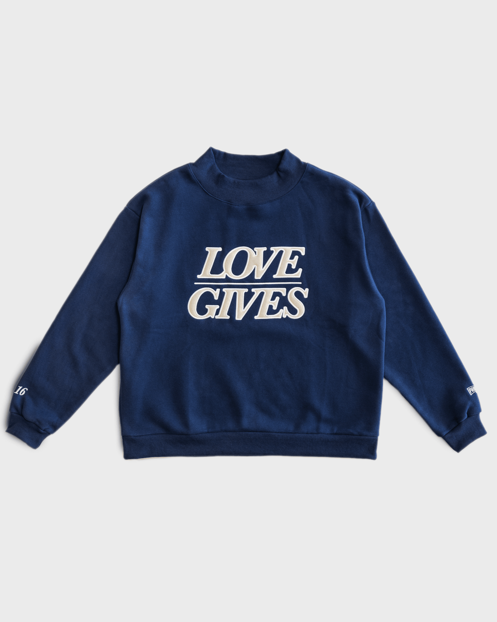 "LOVE GIVES" Navy Mockneck - Proclamation Coalition
