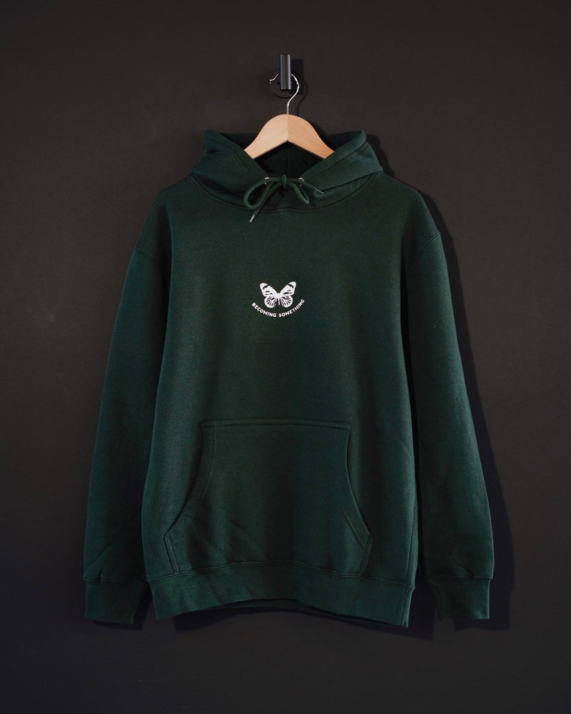 
            
                Load image into Gallery viewer, &amp;quot;Becoming Something Butterfly&amp;quot; - Forest Green Hoodie - Proclamation Coalition
            
        